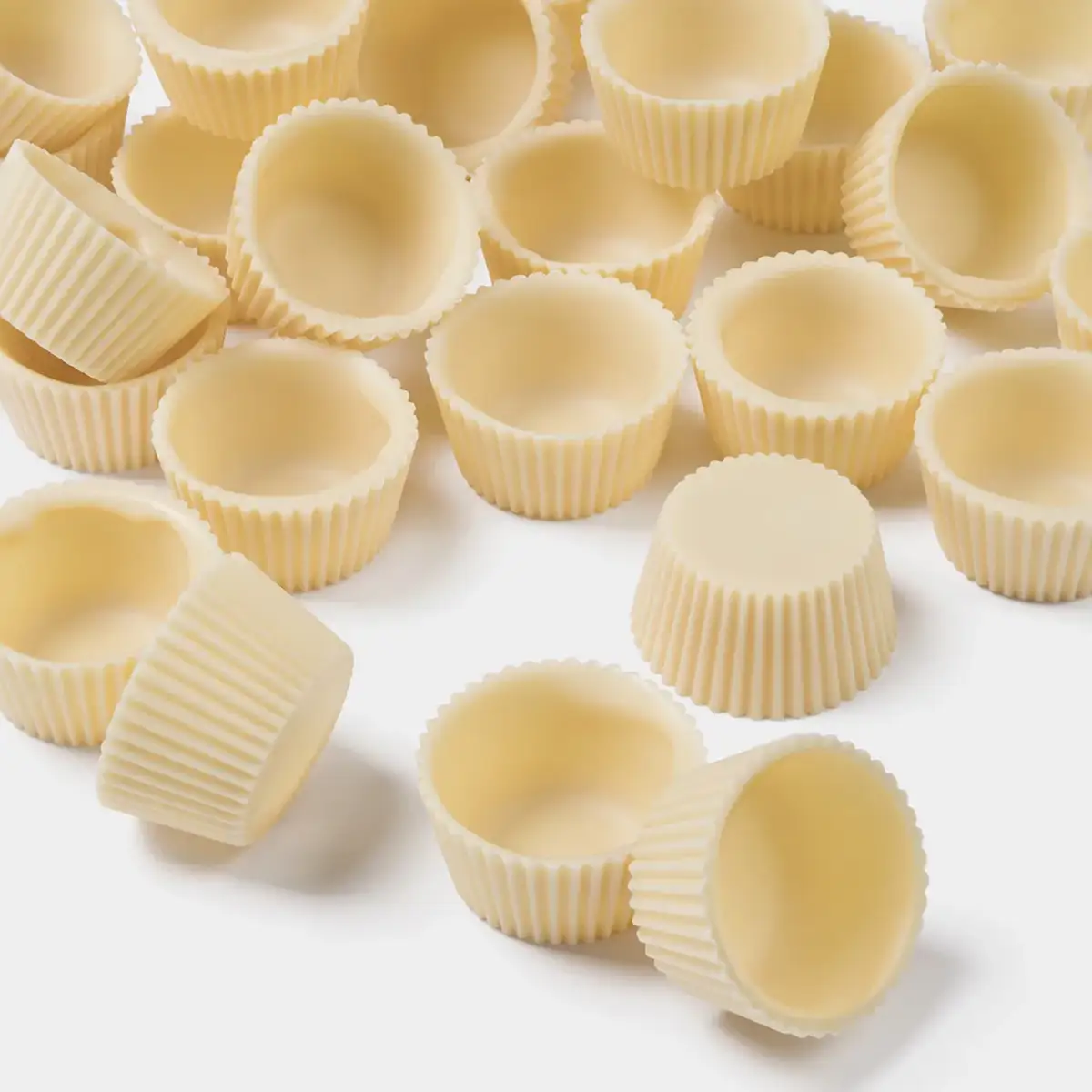 Bodegón de cupcakes de chocolates blanco de la marca Simon Coll